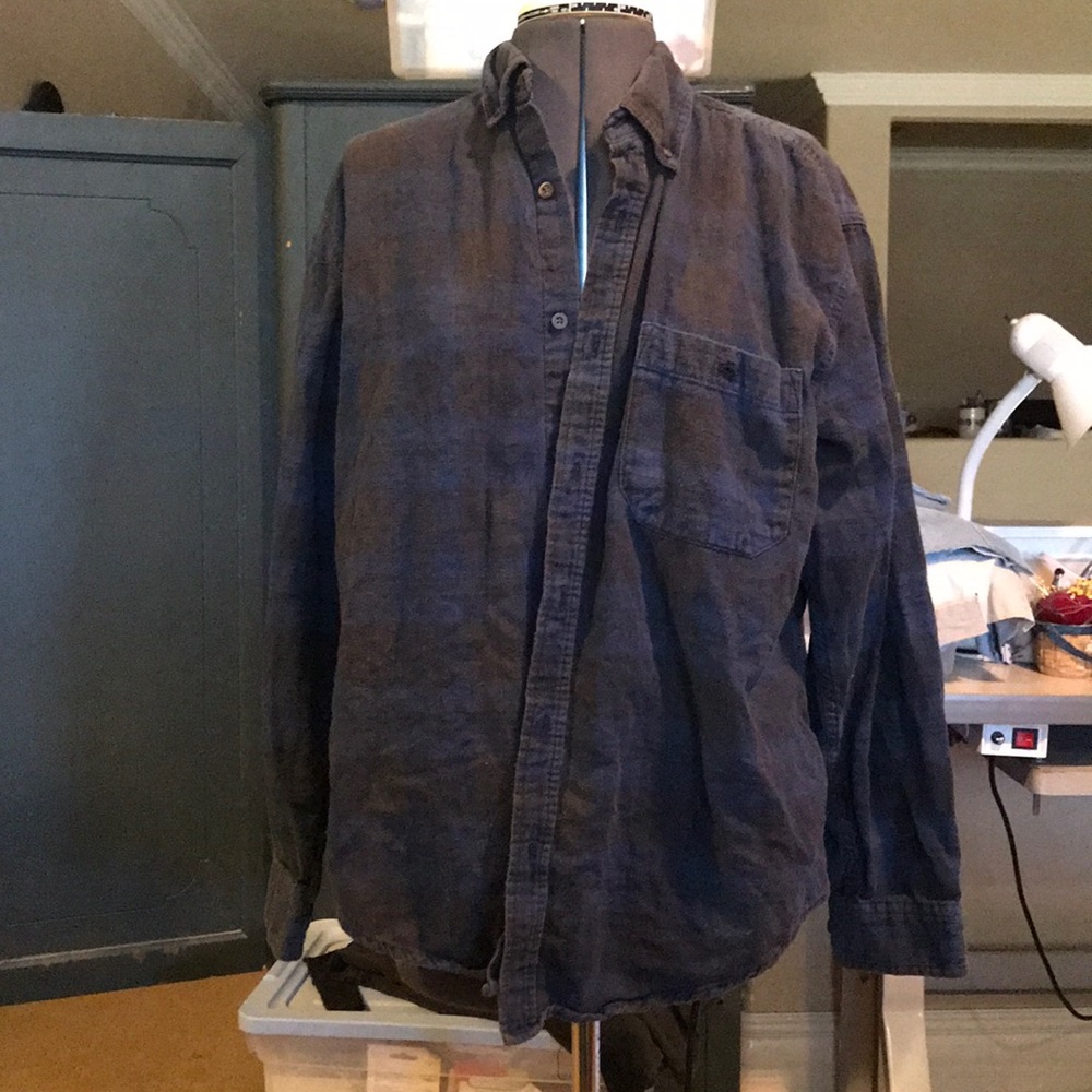 Dark blue plaid shirt.